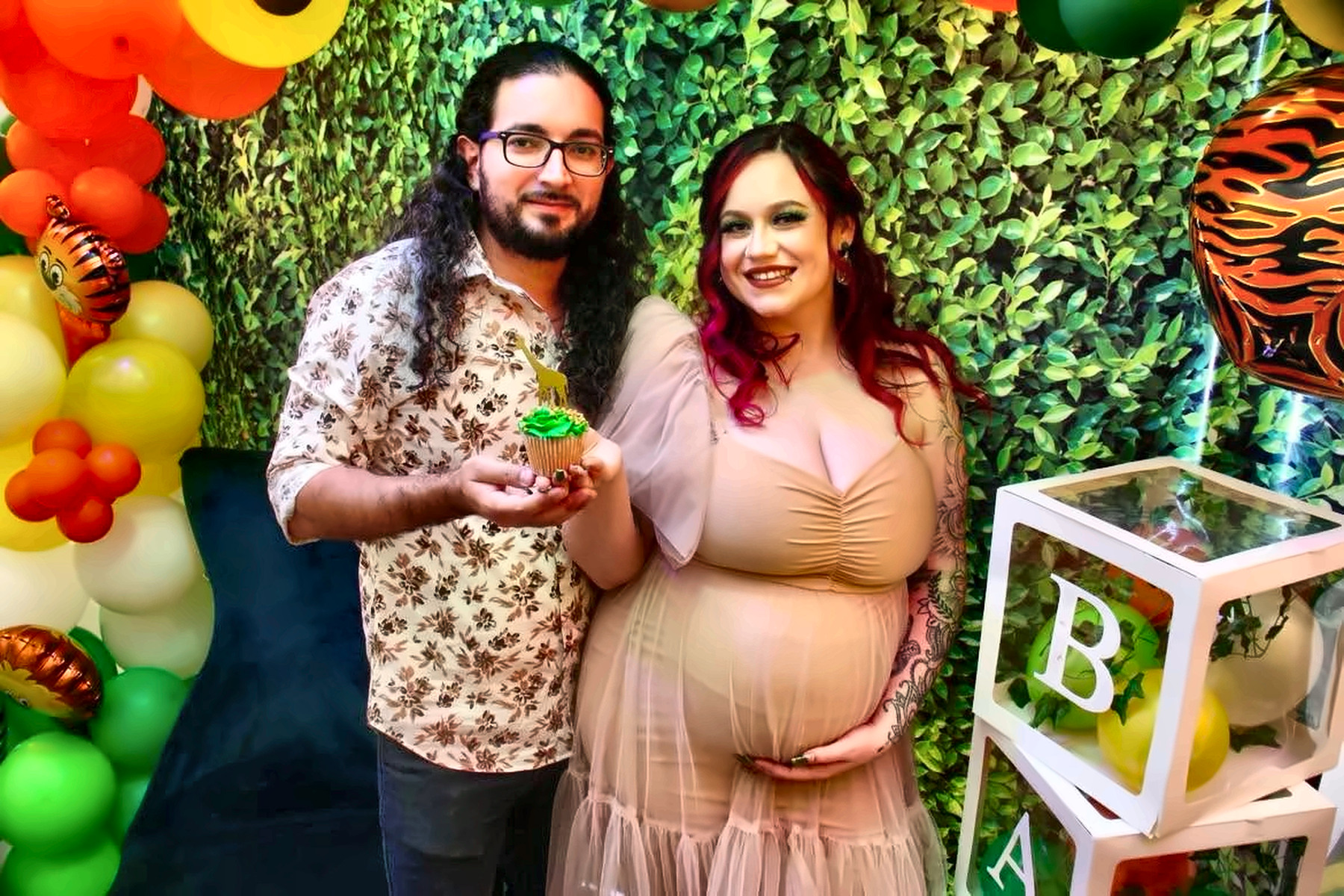 Expecting couple posing at a baby shower