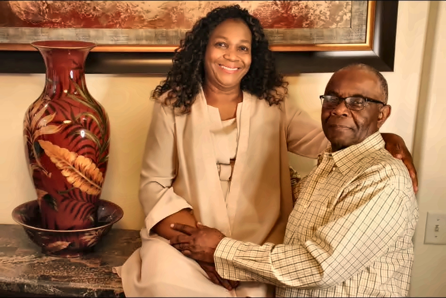 Older couple posing together indoors